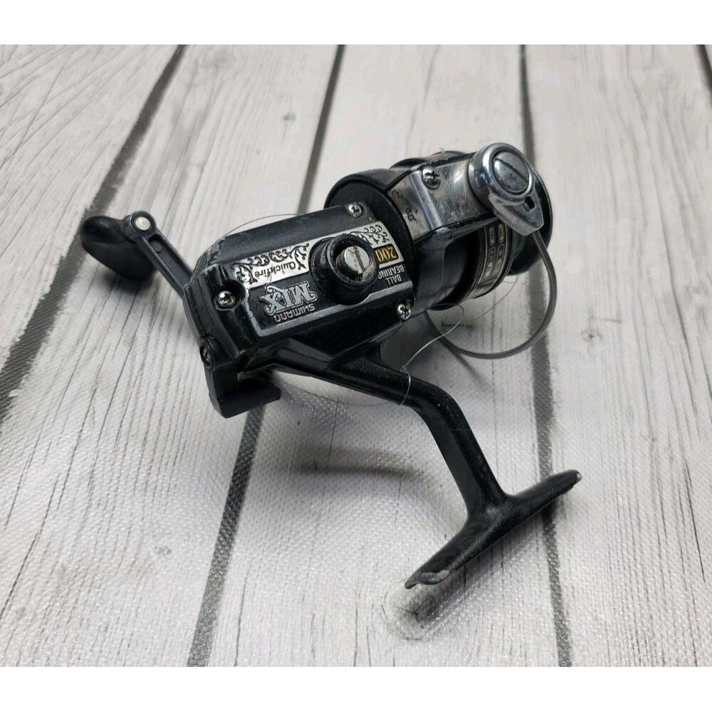 Vintage Shimano Mix 200 Spinning Fishing Reel w/ Quick fire Cast Trigger Japan